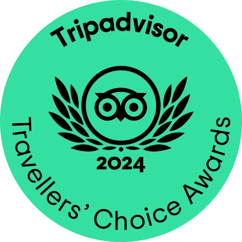 Tripadvisor Travellers' Choice Awards 2024 badge featuring an owl logo and laurel wreath design, indicating recognition for top-rated travel experiences.