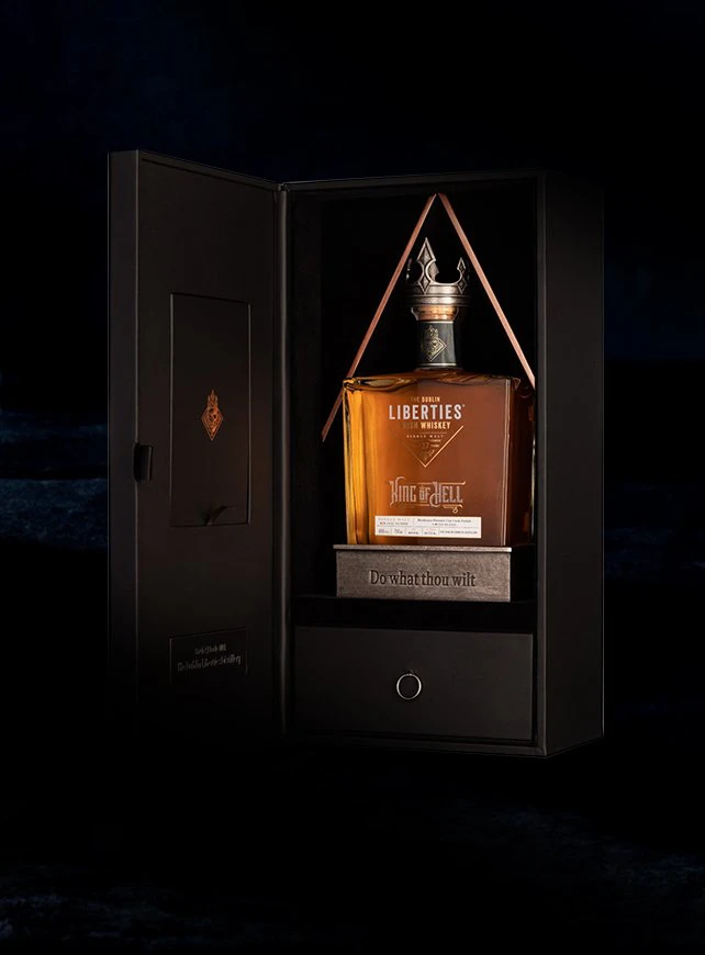 Luxurious bottle of The Liberties Dublin whiskey, titled "King of Hell," displayed in an elegant black box with a drawer, showcasing its premium packaging and craftsmanship.